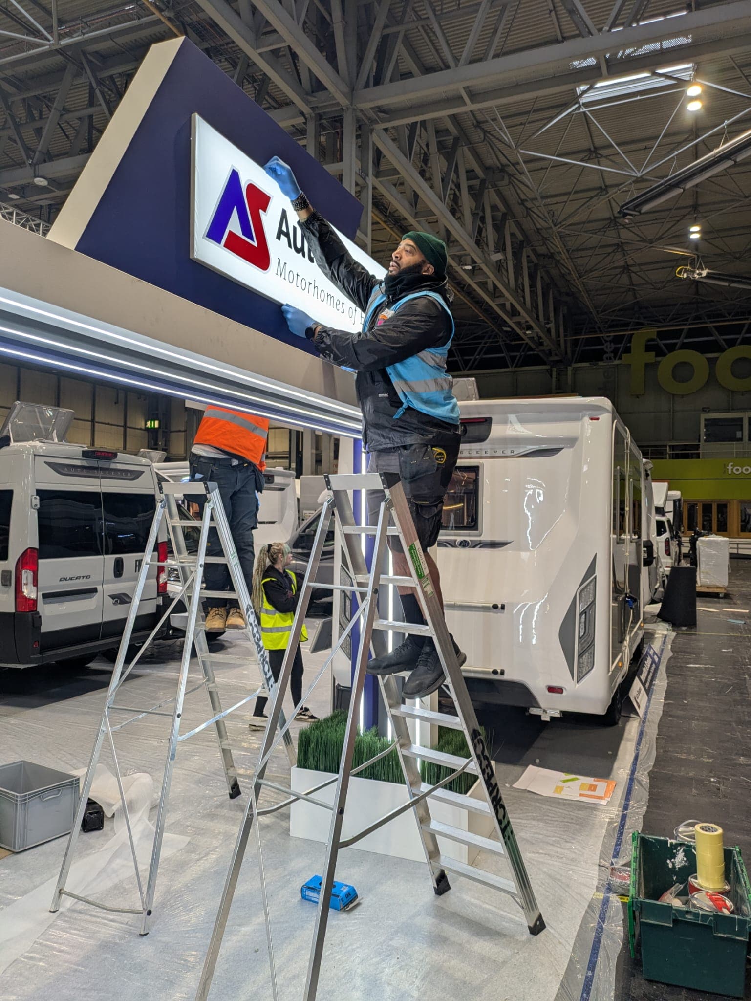 Primo specialists installing signage and event structures